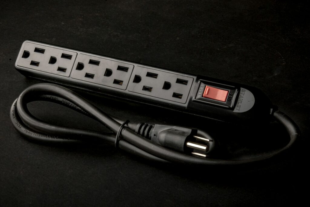 Power strip with surge protection for safe use on a dark background.